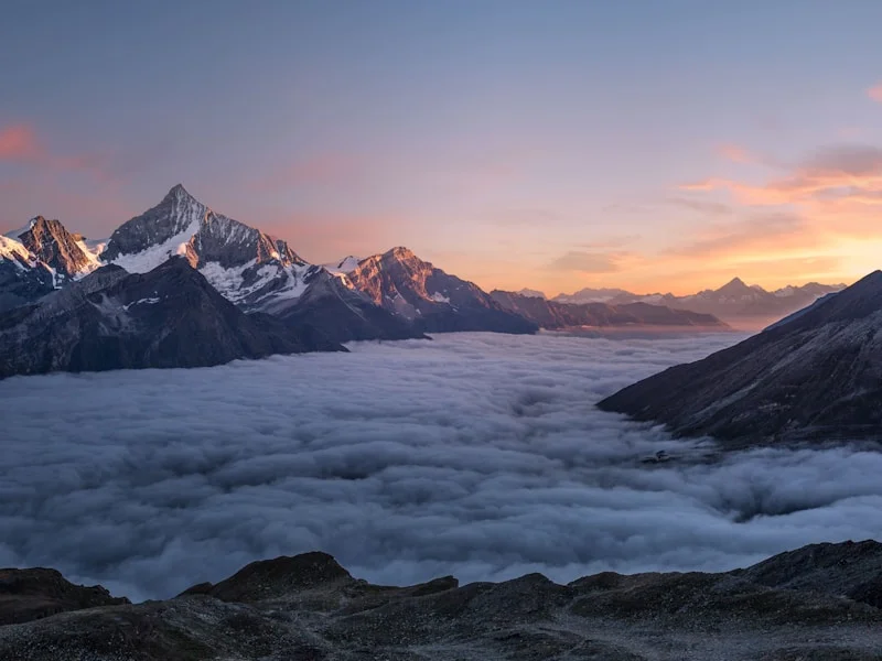 Snowy peaks above a sea of clouds